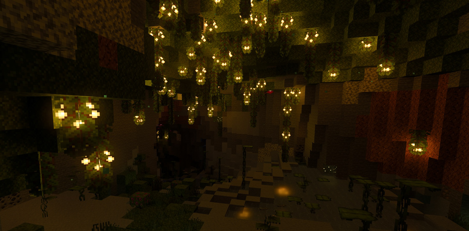 Glow berries hang from the ceiling in a Lush Cave biome